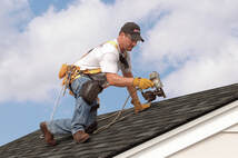 man working on roof
